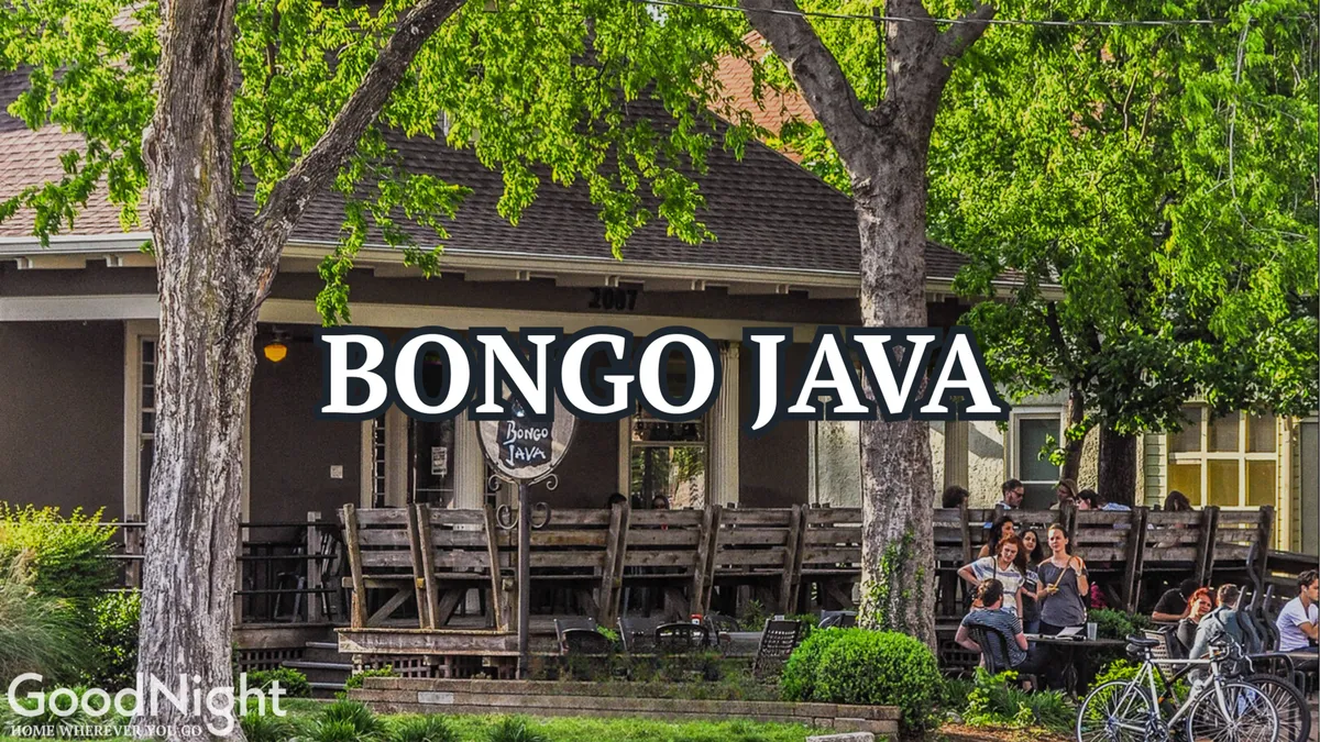 A bustling exterior of Bongo Java cafe with its prominent sign, outdoor seating, and people chatting and enjoying coffee. The atmosphere is casual and lively, reflecting the social heartbeat of the neighborhood.