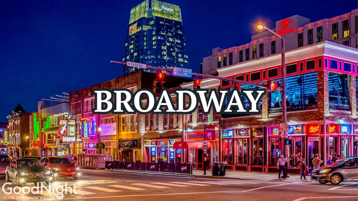 A lively Nashville street scene filled with neon signs, bustling restaurants, cars, and people enjoying the vibrant nightlife. The image captures the essence of the city's energetic culinary and entertainment culture, with diners and music lovers moving between venues.